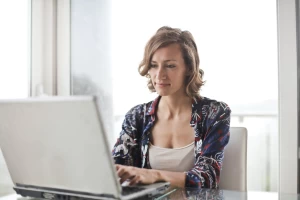 woman searching for an online loan at her computer