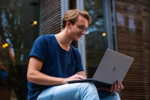 man searching on computer for personal loans