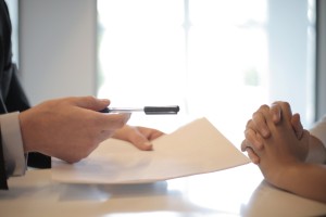 a person signing a personal loan document